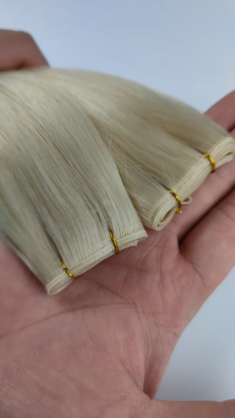 Blonde Genius Weft adhesive-strip track close-up