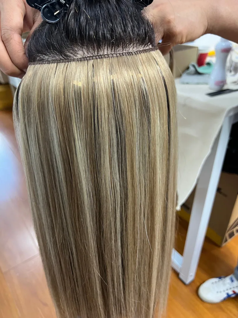 Super Genius Weft installed row with the upper hair lifted to show the track