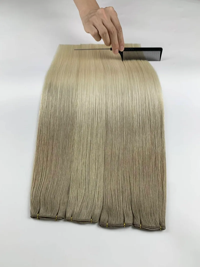 Hair being combed during a careful quality inspection