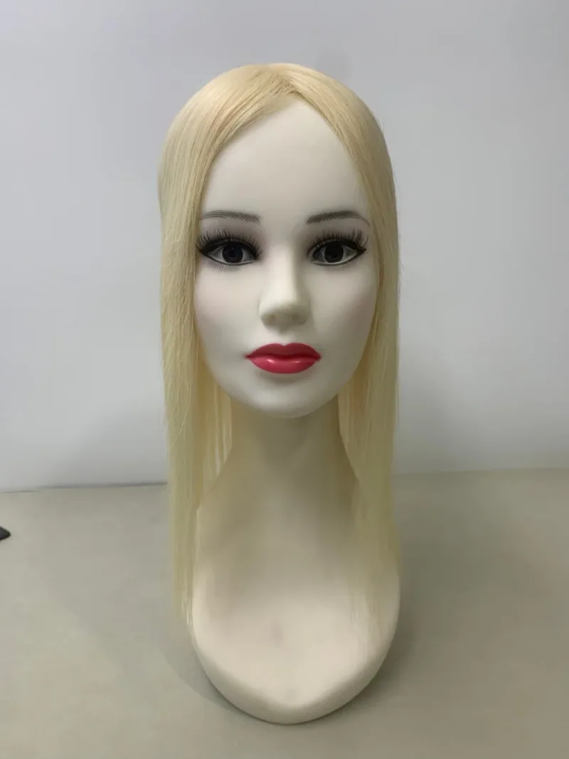 #613 hair topper — front view on a mannequin